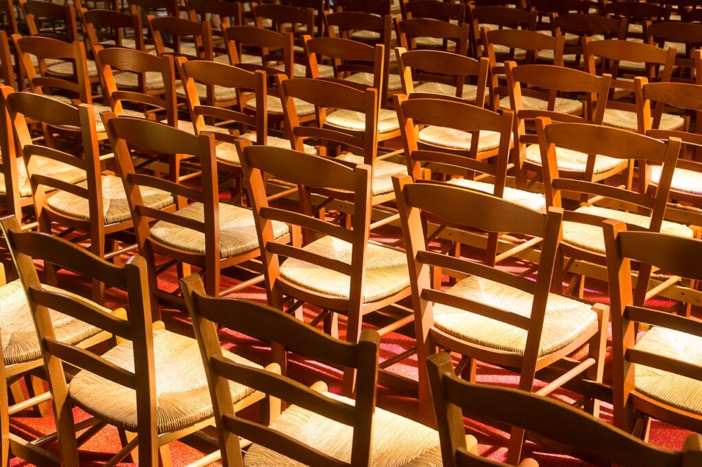 Rows of brown chairs, facing forward.